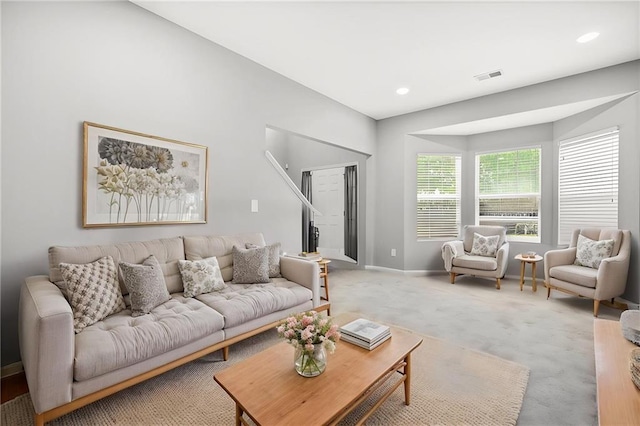 living area featuring baseboards, recessed lighting, visible vents, and carpet