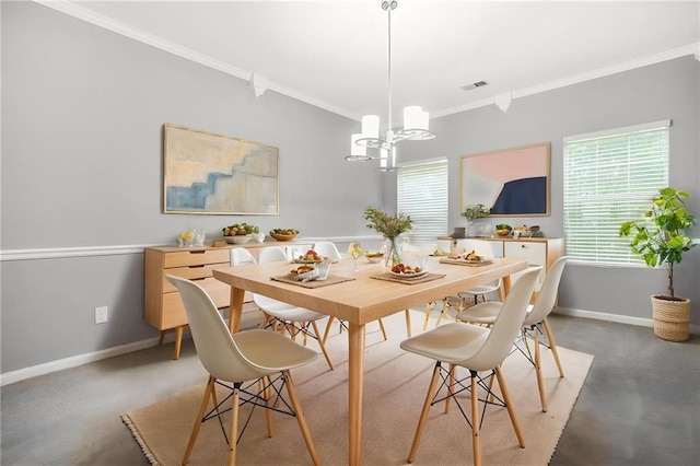 dining room with baseboards, a notable chandelier, a healthy amount of sunlight, and crown molding