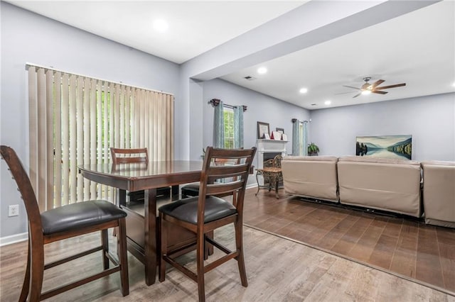dining room with a ceiling fan, recessed lighting, visible vents, and light wood-type flooring