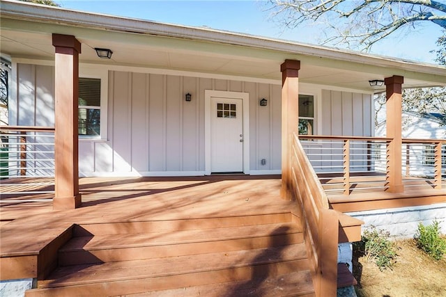 wooden terrace featuring covered porch