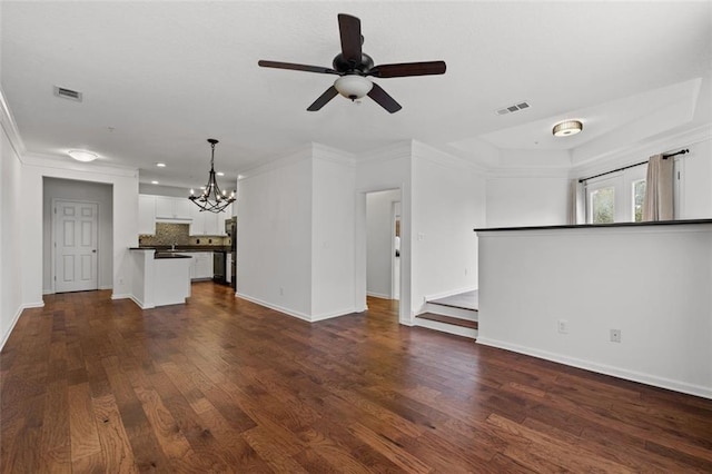 400 17th St NW Unit 1321, Atlanta, GA 30363 - unfurnished living room featuring a chandelier, dark wood-type flooring, baseboards, crown molding, and recessed lighting