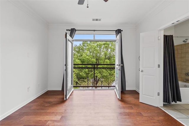 400 17th St NW Unit 1321, Atlanta, GA 30363 - spare room with crown molding, wood finished floors, ceiling fan, and baseboards