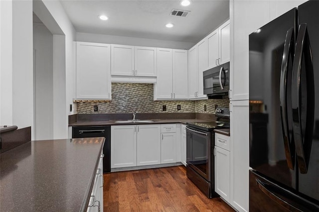 400 17th St NW Unit 1321, Atlanta, GA 30363 - kitchen featuring black appliances, dark countertops, a sink, white cabinets, and recessed lighting