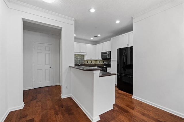 400 17th St NW Unit 1321, Atlanta, GA 30363 - kitchen with freestanding refrigerator, electric stove, a peninsula, white cabinets, and dark countertops