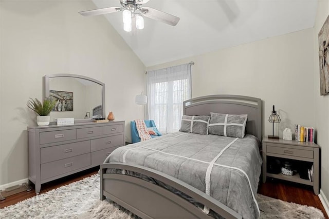 bedroom with dark hardwood / wood-style flooring, ceiling fan, and lofted ceiling