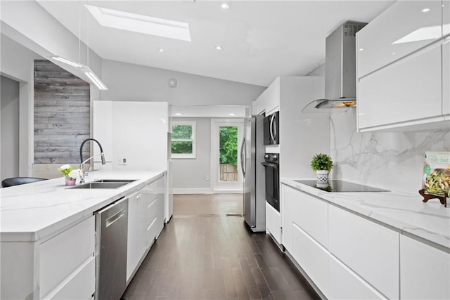2123 Drew Valley Rd NE, Brookhaven, GA 30319 - kitchen featuring a sink, black appliances, wall chimney range hood, modern cabinets, and lofted ceiling