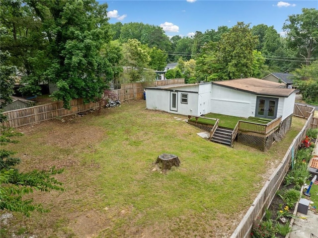 2123 Drew Valley Rd NE, Brookhaven, GA 30319 - view of yard with french doors, a deck, and an outdoor fire pit