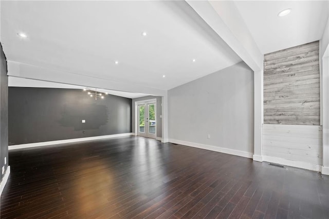 2123 Drew Valley Rd NE, Brookhaven, GA 30319 - empty room with an accent wall, baseboards, wood finished floors, and recessed lighting