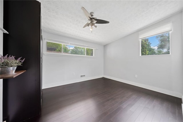 2123 Drew Valley Rd NE, Brookhaven, GA 30319 - empty room featuring a textured ceiling, baseboards, a ceiling fan, and wood finished floors