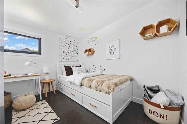 2123 Drew Valley Rd NE, Brookhaven, GA 30319 - bedroom with vaulted ceiling, dark wood-style floors, and baseboards