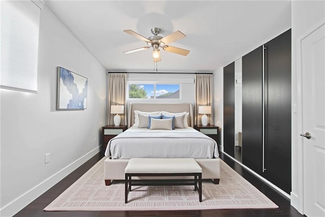 2123 Drew Valley Rd NE, Brookhaven, GA 30319 - bedroom with baseboards, dark wood-type flooring, and ceiling fan