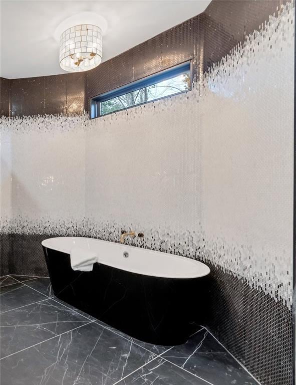 bathroom featuring a tub to relax in