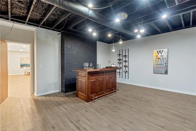 bar with wood-type flooring