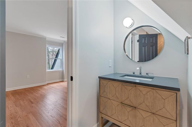 bathroom featuring vanity and hardwood / wood-style flooring