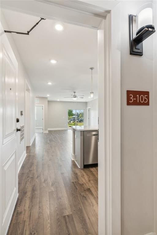 hall with wood-type flooring