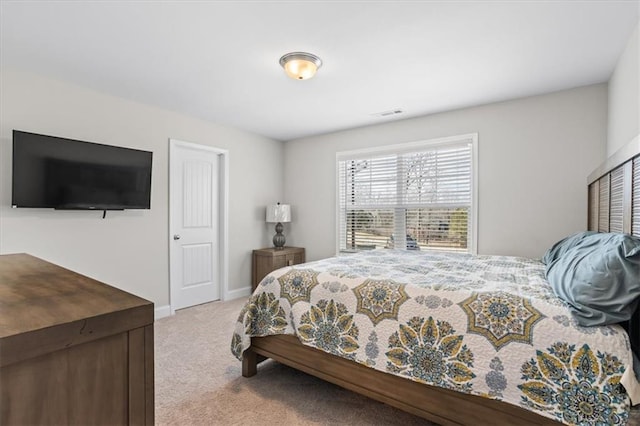 bedroom featuring light colored carpet