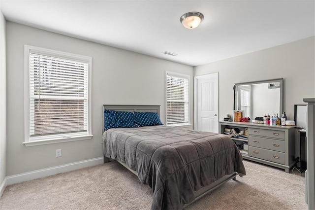 bedroom featuring light carpet