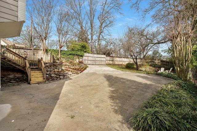 view of yard featuring a patio and fence