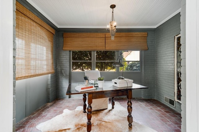 office space featuring crown molding, visible vents, and brick wall