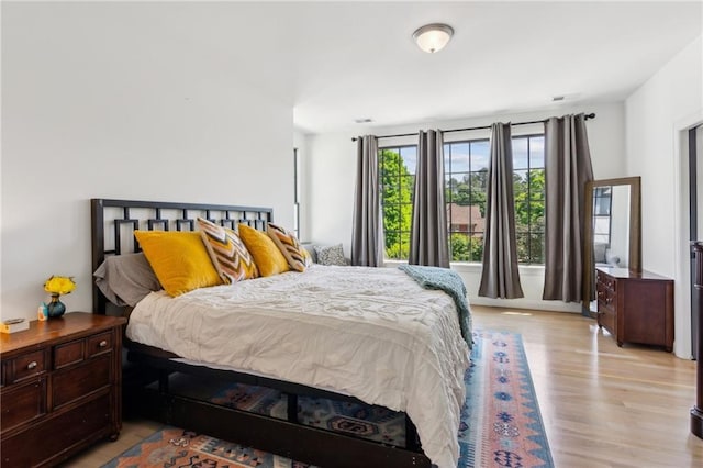 bedroom with wood finished floors