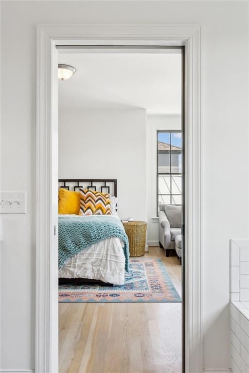 bedroom with wood finished floors