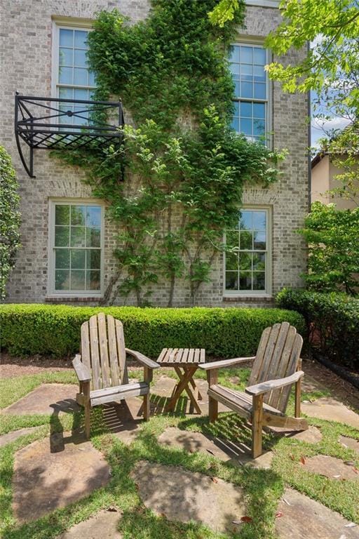 exterior space with brick siding