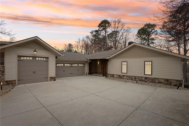 view of front of property featuring a garage and driveway