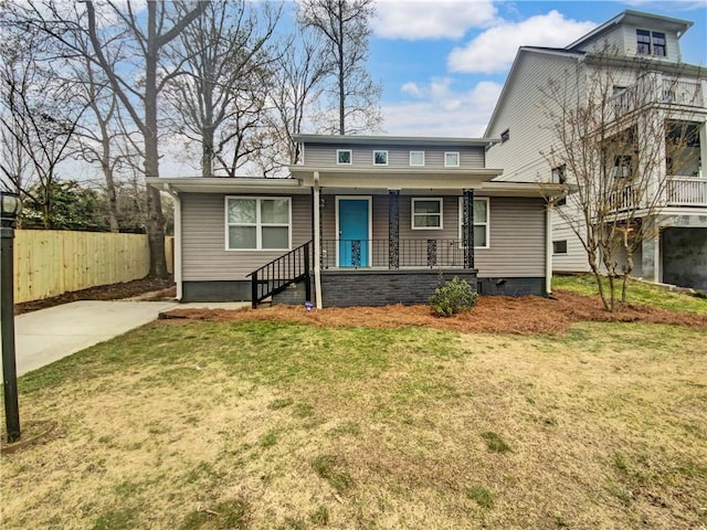 view of front facade with a front lawn and covered porch