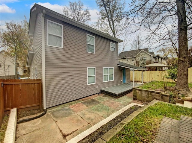 back of house with a patio area