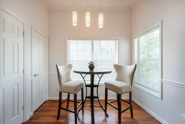 dining area with baseboards, dark wood-style floors, and ornamental molding