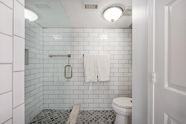 full bath featuring visible vents, a stall shower, and toilet