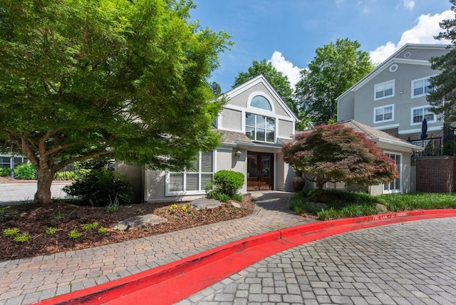 view of front of house featuring stucco siding