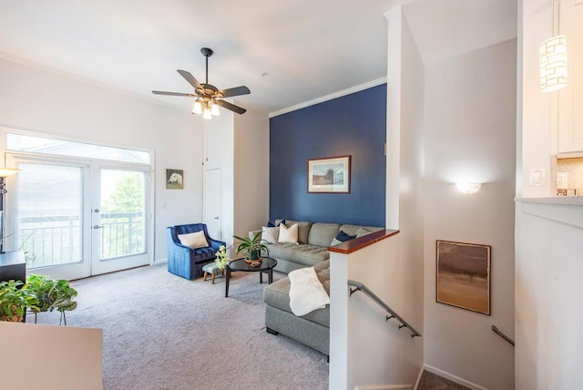 living room with crown molding, carpet floors, ceiling fan, and french doors