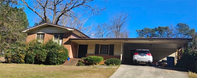 split level home featuring an attached carport and concrete driveway