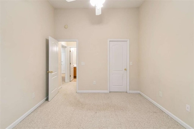 184 Darbys Crossing Ct, Hiram, GA 30141 - unfurnished bedroom featuring light colored carpet, baseboards, a high ceiling, and a ceiling fan
