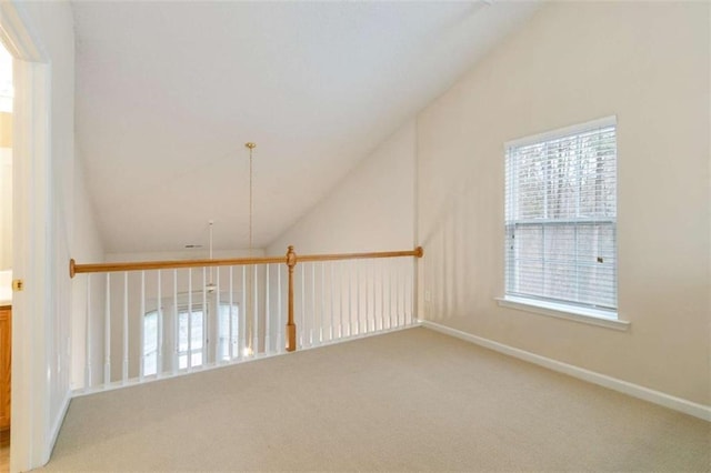 184 Darbys Crossing Ct, Hiram, GA 30141 - hallway featuring vaulted ceiling, light carpet, plenty of natural light, and baseboards