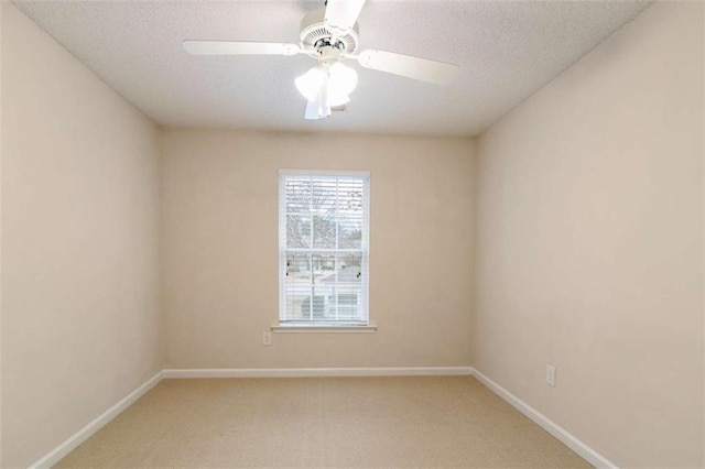 184 Darbys Crossing Ct, Hiram, GA 30141 - spare room featuring light carpet, baseboards, ceiling fan, and a textured ceiling