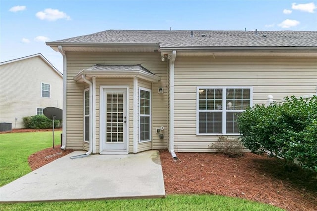 184 Darbys Crossing Ct, Hiram, GA 30141 - rear view of house featuring a patio area, a lawn, roof with shingles, and cooling unit