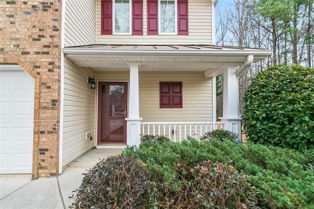 184 Darbys Crossing Ct, Hiram, GA 30141 - entrance to property with a porch and a standing seam roof