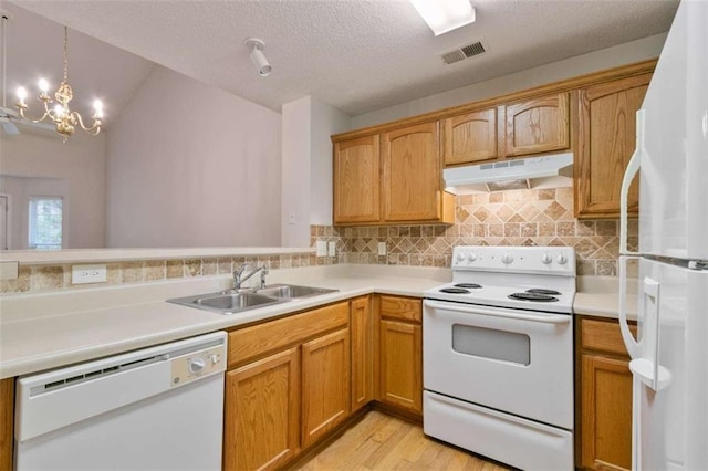 184 Darbys Crossing Ct, Hiram, GA 30141 - kitchen with white appliances, under cabinet range hood, a sink, light wood-style floors, and light countertops