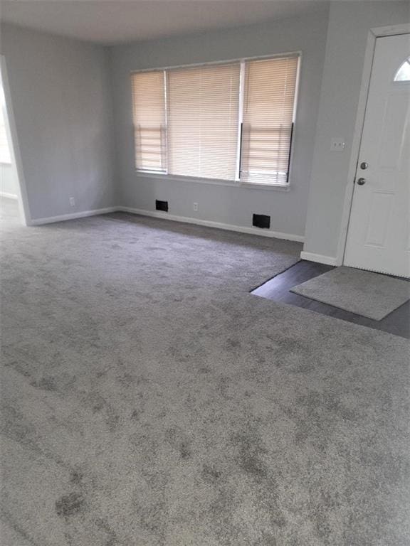 view of carpeted foyer