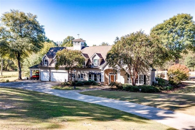 view of front facade featuring a garage and a front lawn