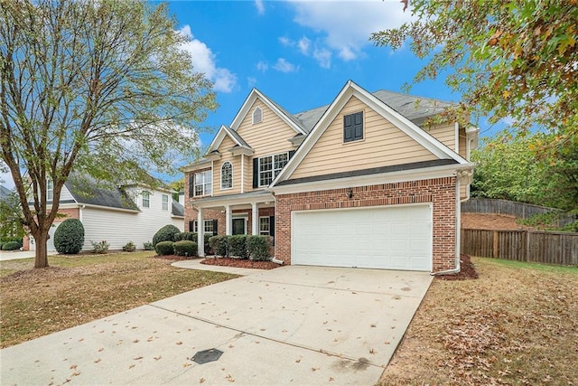 view of front of property with a front yard and a garage