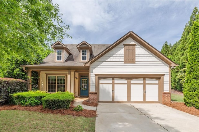 view of front of property featuring brick siding and driveway