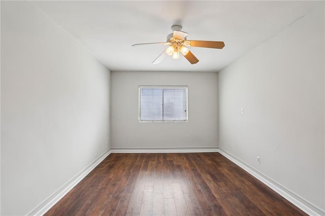 unfurnished room featuring ceiling fan, hardwood / wood-style flooring, and baseboards