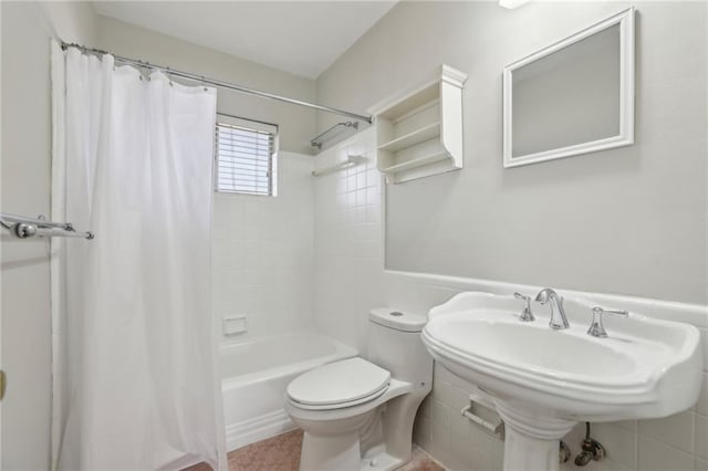 full bath featuring toilet and shower / tub combo with curtain