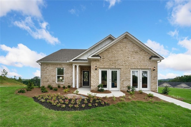 craftsman inspired home featuring french doors and a front yard