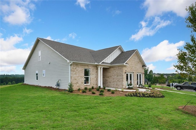 view of home's exterior with a yard