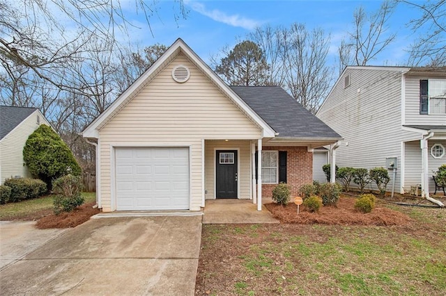 view of front of property with concrete driveway, brick siding, an attached garage, and roof with shingles