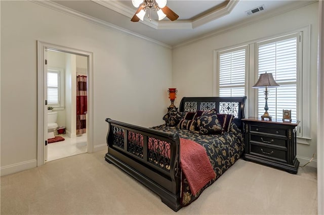 bedroom featuring ensuite bathroom, carpet floors, baseboards, ornamental molding, and visible vents